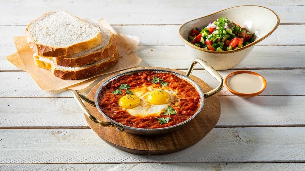 Aroma Espresso Bar shakshuka with bread and Israeli salad